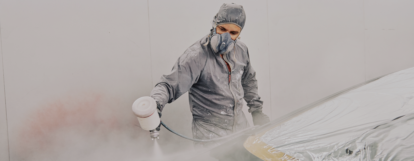 a man painting a car